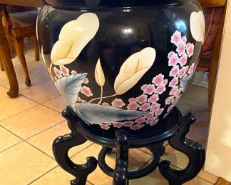 Chinese porcelain planter on a carved five leg ebony wooden stand.