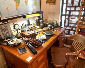 Large, heavy, oak teachers desk and swivel chair. Large, framed world map. and a collection of antique and current, foreign and domestic incense burners.