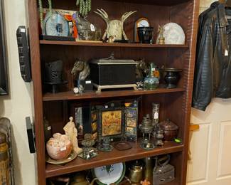 Lots of western boots, many collectible items on a tall (over 7') shelf. Three shelves available.