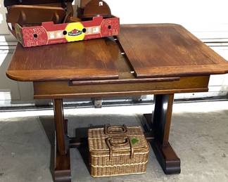 Sturdy oak, trestle base dining table with draw leaf expansion. (Shown partially expanded.)