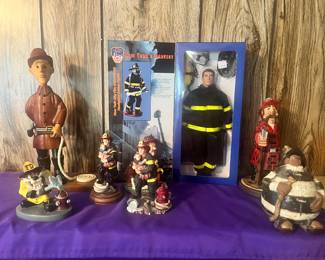 Selection of firefighter statues, and memorabilia