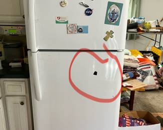 Frigidaire refrigerator/freezer. Slight damage shown