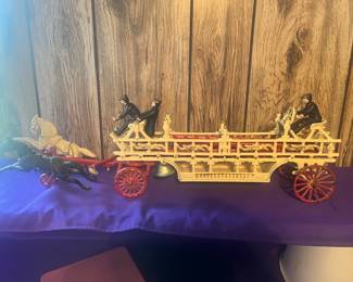 Cast iron ladder wagon with horses and firefighters 