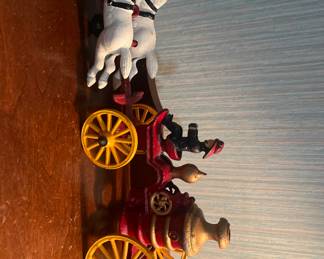 Cast iron water wagon with horses and men