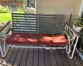 Glider with cushion
