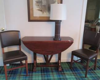 Drop leaf table and 2 leather chairs.