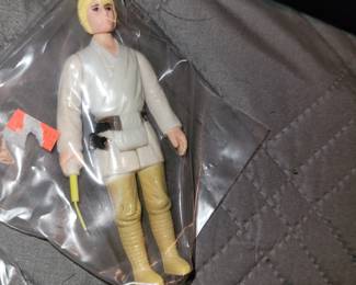 Notice Luke has his Lightsaber