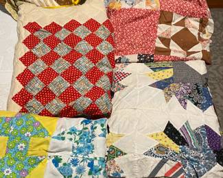 Several old quilt tops