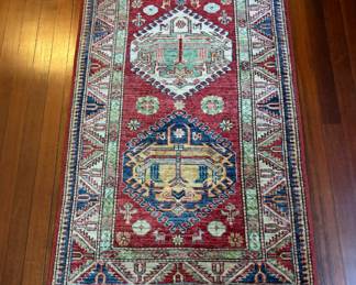 143. Red, Blue, and Tan Hand Knotted Rug w/ 2 Medallions (31" x 50")