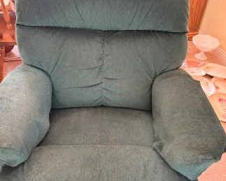 Reclining Chair Covered In Green Fabric