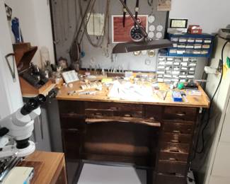 "Available for resale" this is a complete watchmaker’s or jeweler’s bench setup with tools, drawers, microscope, and precision parts organizers.