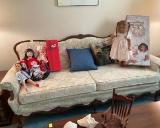 Upholstered sofa and dolls