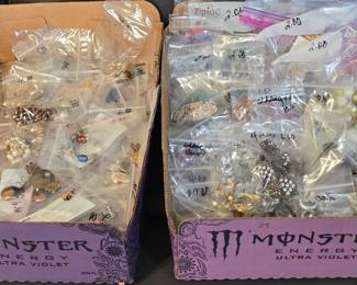 Two flats of costume jewelry.