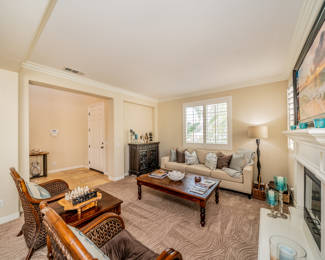 Wine cabinet, couch, end table, rattan chairs, coffee table