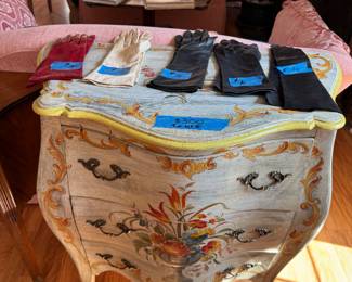 Painted dresser and leather gloves