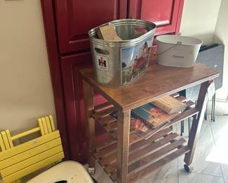 cooker, microwave cart, cookbooks, metal buckets