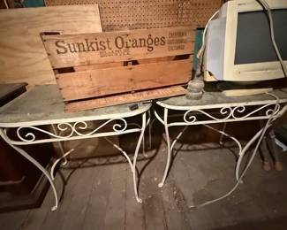 Wrought iron patio furniture. Glass tops.
