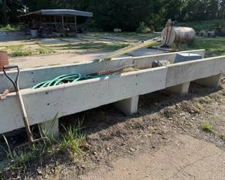 Concrete feed bunks. Great for flower beds. We have a loader.