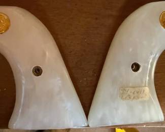 Pearl handle single action Colt grips.