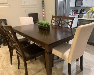 Solid wood dining room table with extension and 6 chairs.