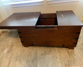 Chest/ table slides to open. 