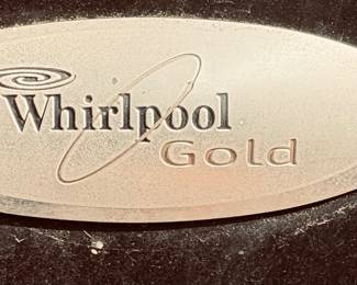 Large Whirlpool Gold Outdoor Refrigerator.