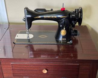 Vintage Singer machine and cabinet