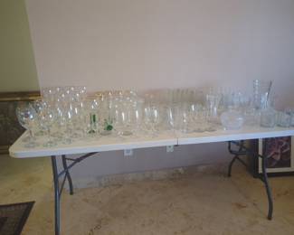 Assorted stemware, drinking glasses and other crystal items.