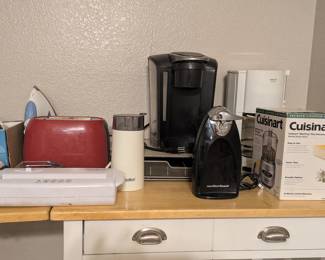 Appliances: Toaster, coffe grinder, 2 irons, keurig single cup coffee maker. Regular coffee maker, can opener, cuisinart food chopper, and more. We also have a vacuum.