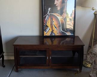 Entertainment stand and Elvis picture