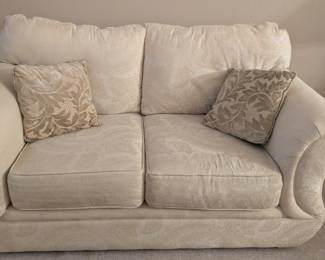 We have 2 of these cream color tapestry love seats