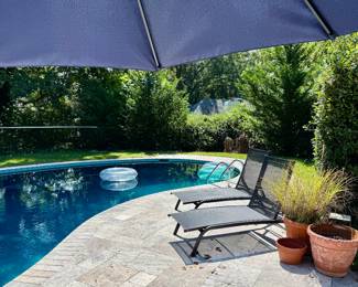 Two NEW chaise lounge chairs, umbrellas, planters, and...a glass pumpkin patch!