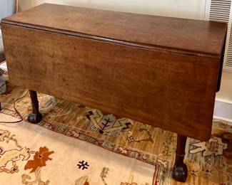 Antique ball and claw foot drop leaf table. Super old and rare...heavy and has a patina to die for!