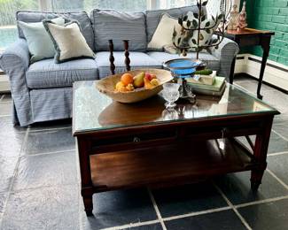 Slipcovered sofa, beautiful solid wood coffeet able, tole decor, vintage dough bowls, stonefruit collection, barley twist candlesticks from the 1800's...