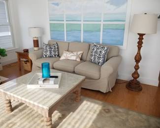Braxton Culler couch; floor lamp; rustic coffee table