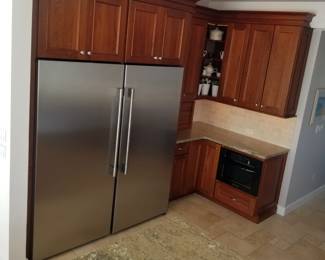 Stunning chef's kitchen with a full size refrigerator and a full size freezer