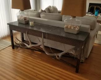 Sofa table; table lamps; driftwood