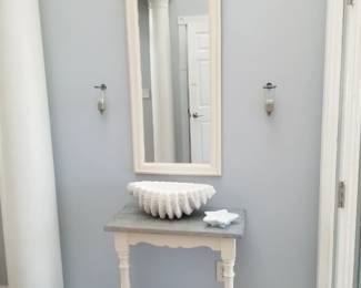 Foyer table; shell bowl; mirror