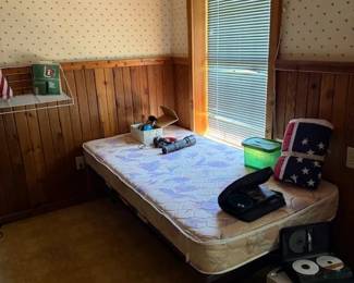 Twin bed with throw and cds in cases