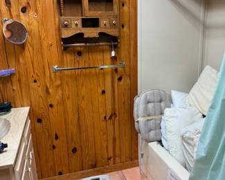 Pillows and wood shelf, scale and bathroom items