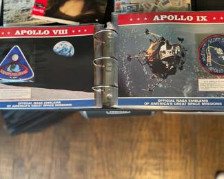 Binder full of NASA Space Mission Badges
