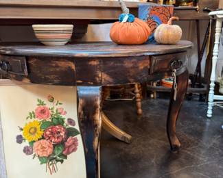 Solid wood rustic half moon side table with 2 small drawers, framed floral art, pumpkins, bowls