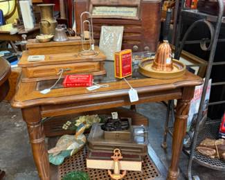 wooden side table with lower shelf and decorative items
