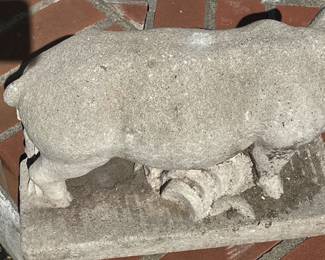 Shy concrete pig leaving photo frame