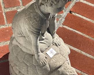 Concrete boy on turtle