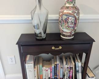 Entry table with beautiful vases and books