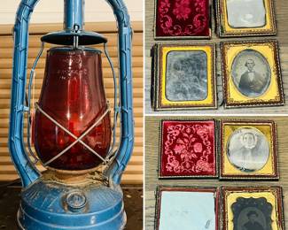 Vintage 1952 Syracuse NY Dietz Monarch blue oil lantern with Railroad red globe and a collection of daguerreotypes photography. 