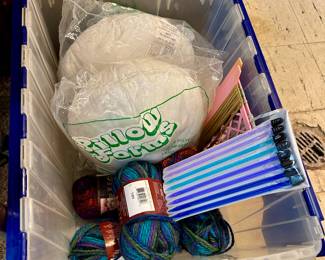 Yarn, kitting needles and pillow inserts.