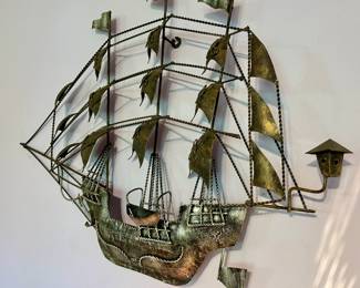 Vintage metal ship wall art.