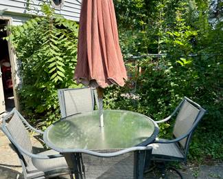 Patio set with umbrella and stand.